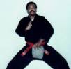 3 Pictures - Grandmaster Dan McEaddy demonstrating finger conditioning